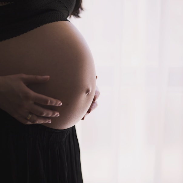 woman holding stomach