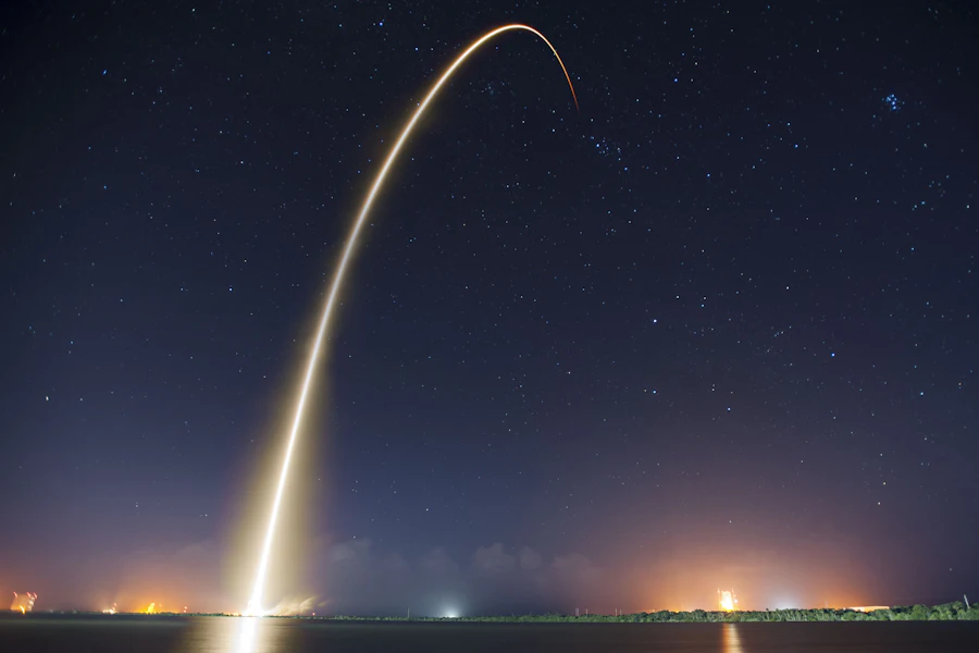 A rocket launching into the night sky