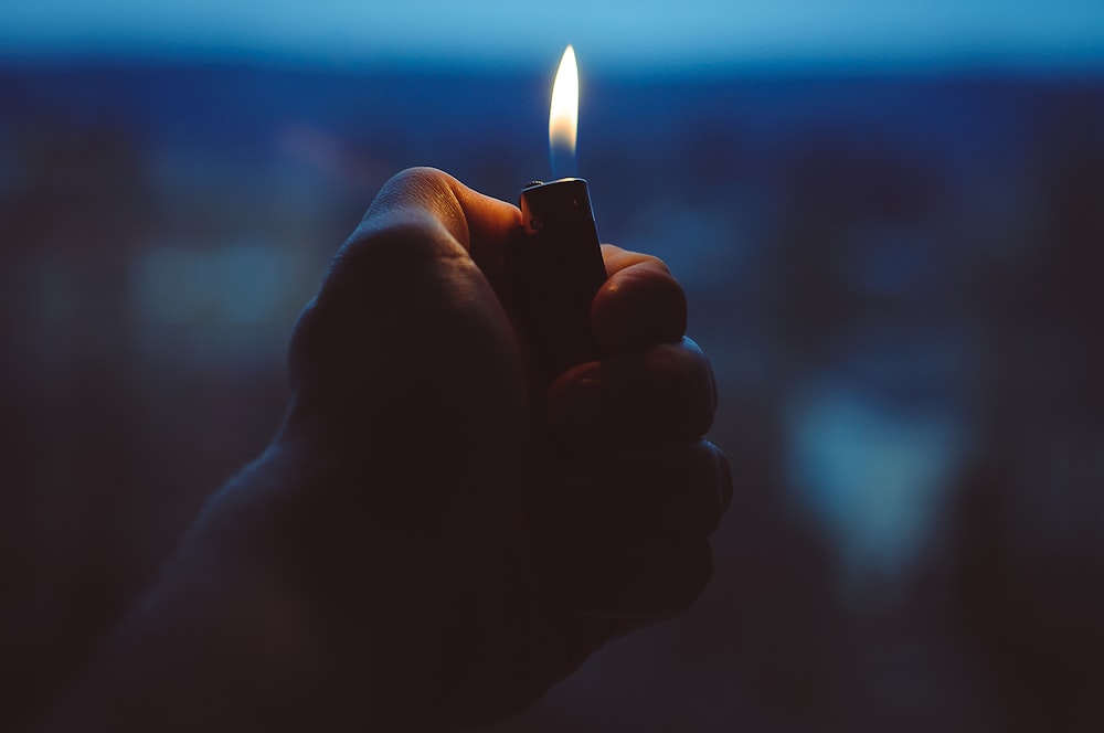 person holding black lighter