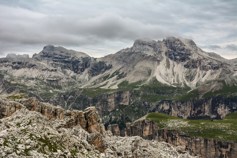 green grass covered mountain range