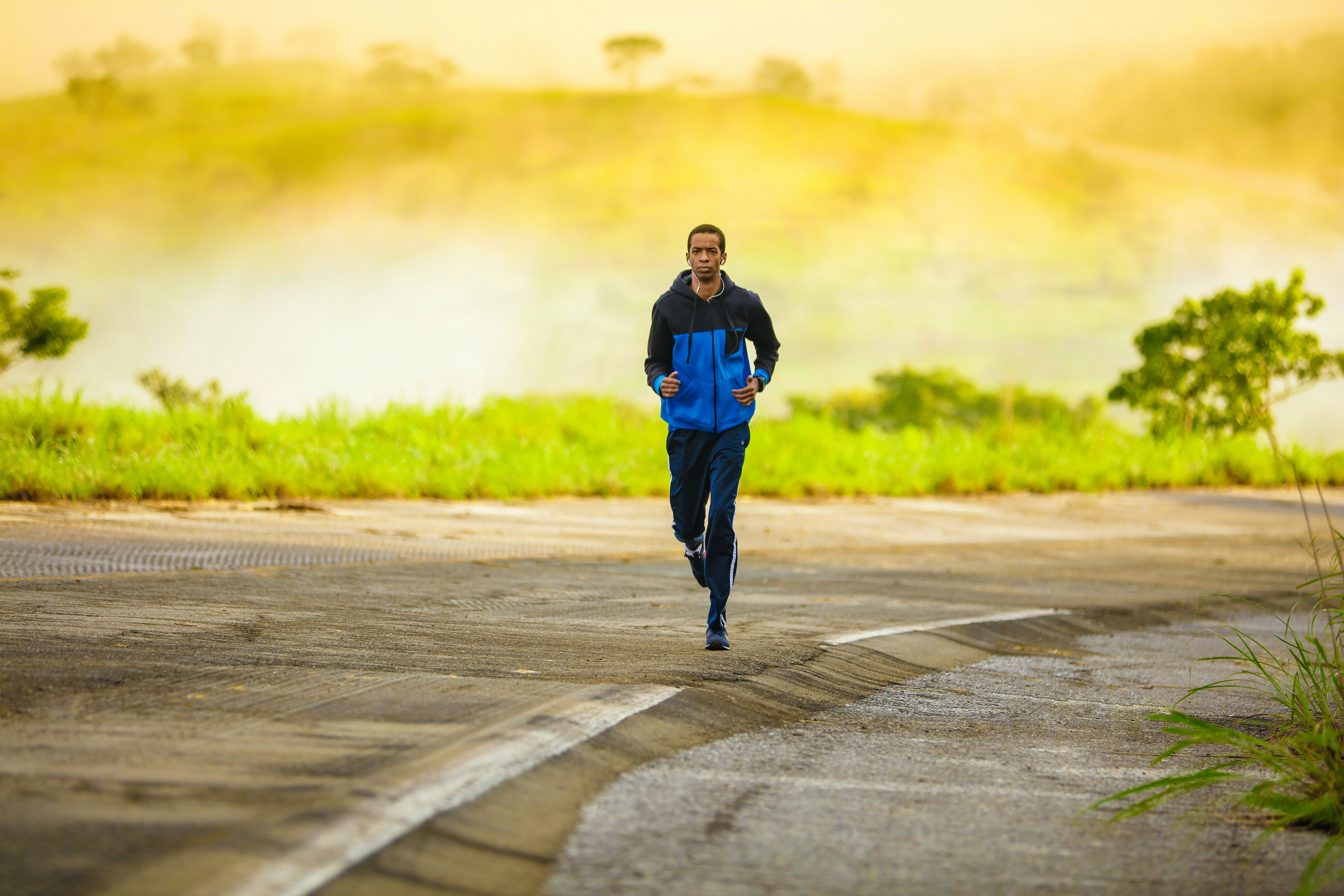 Man running down side of road