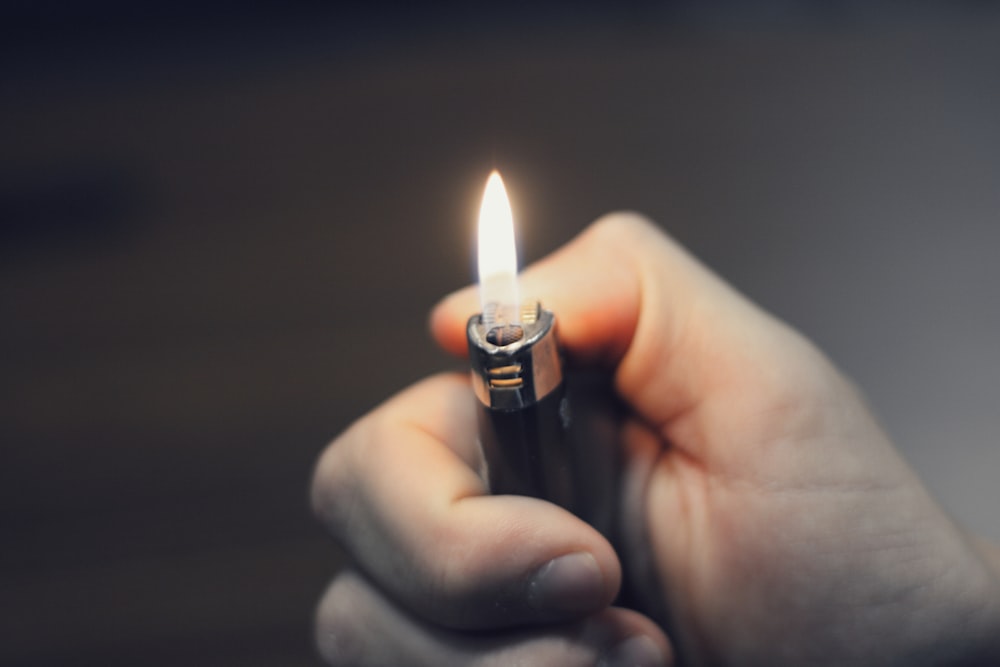 person holding black lighter