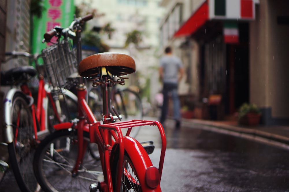 selective focus photography of red bicycle