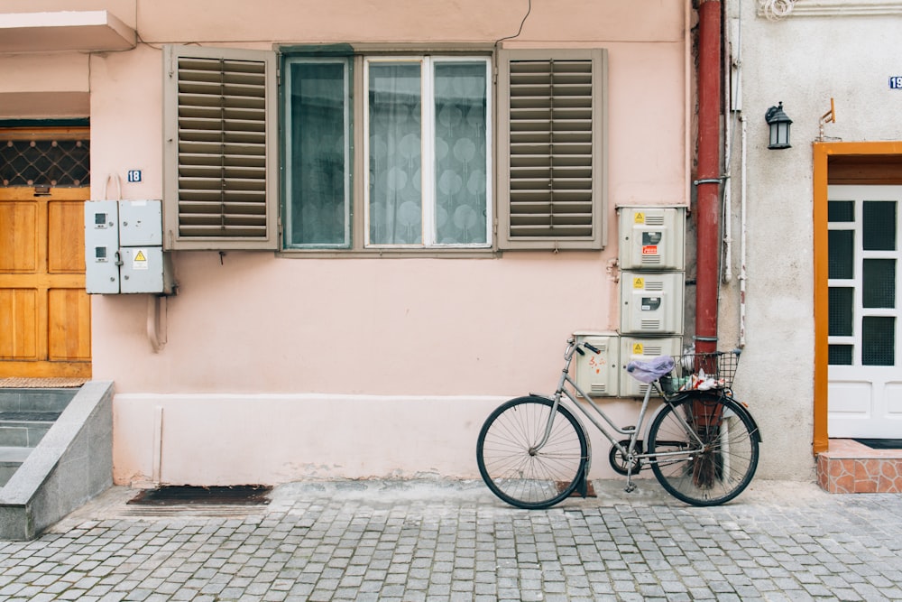 gray bicycle near house