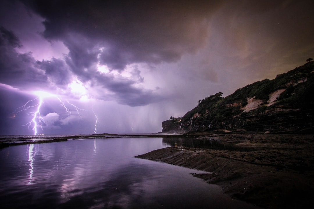 lightning near body of water and rock formation, Purple Lightning Dee Why