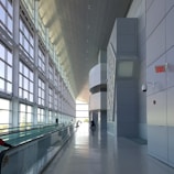 Wide shot of a modern facility with multiple automatic sliding doors.