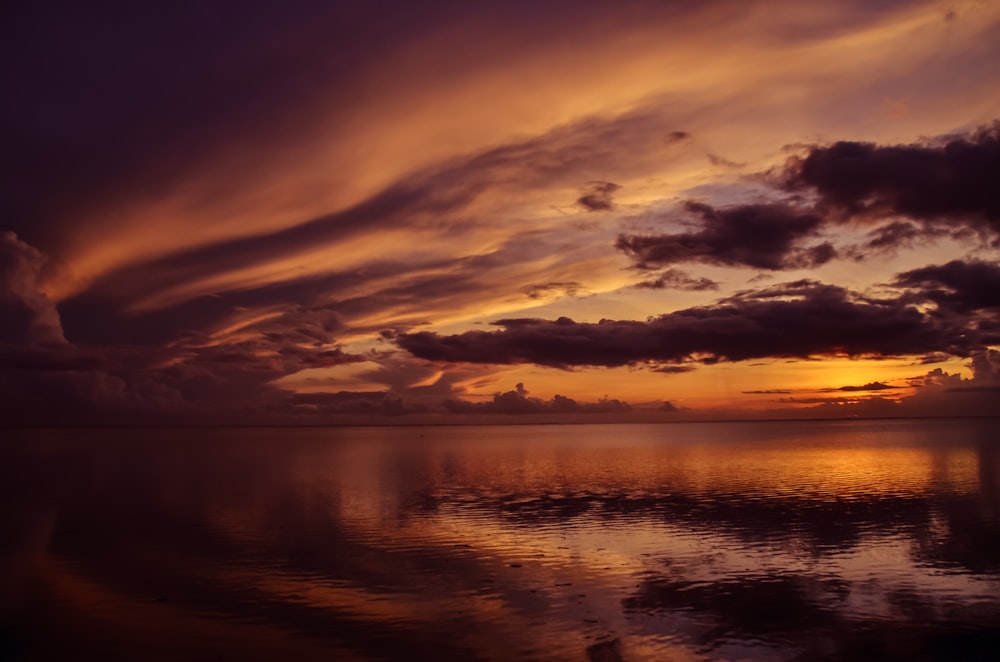 body of water during dawn