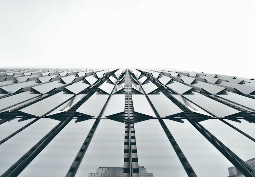 low angle photography of clear glass architectural design