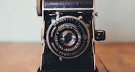 black Prontor II camera on brown wooden board