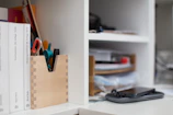 A shelf filled with various digital resources and gadgets.
