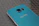 Photo of a satisfied customer holding a Samsung Galaxy A16 after repair at Orbitech Dgo.