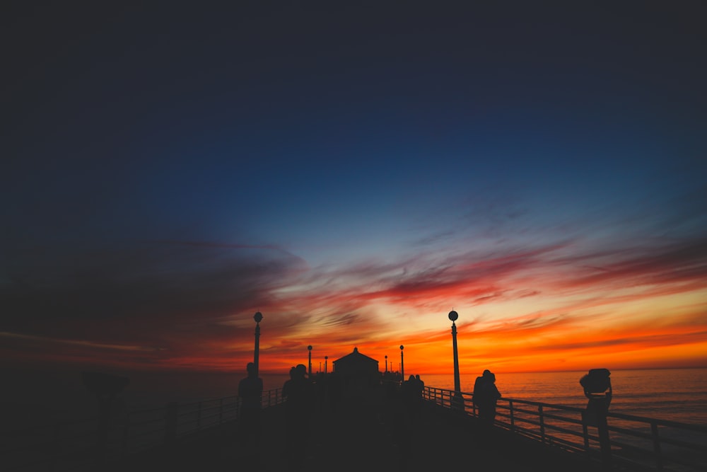 silhouette of wooden docks during golden hour