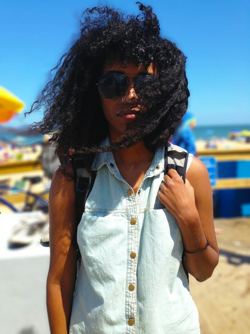 selective focus photography of person standing on seashore