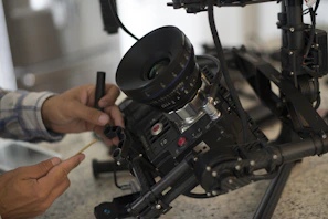 Technician adjusting the angle of a dome camera on a ceiling
