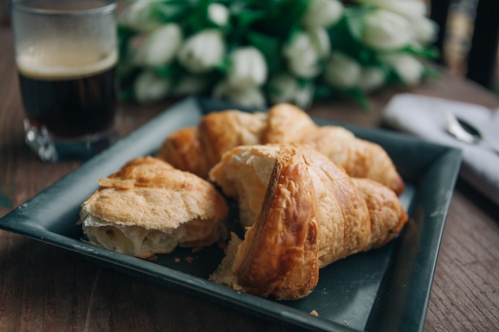 black ceramic tray with bread on top