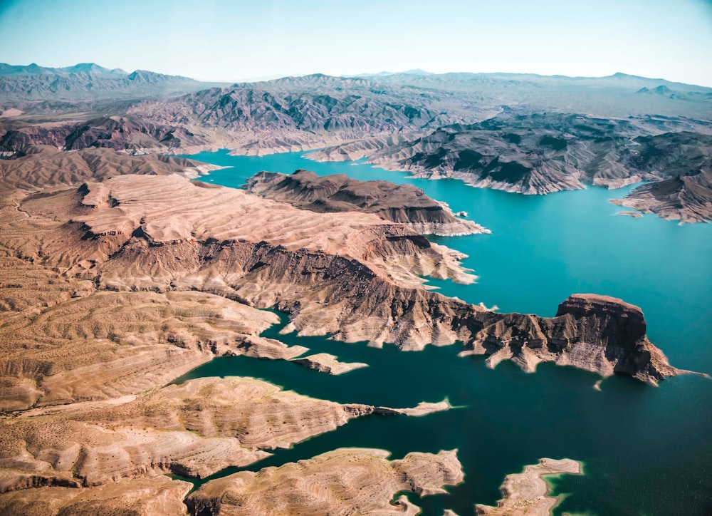 body of water surrounded with mountains