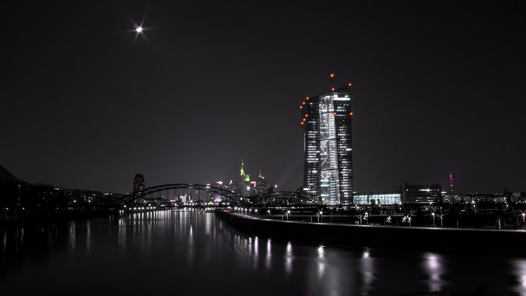 lighted bridge over water during night time