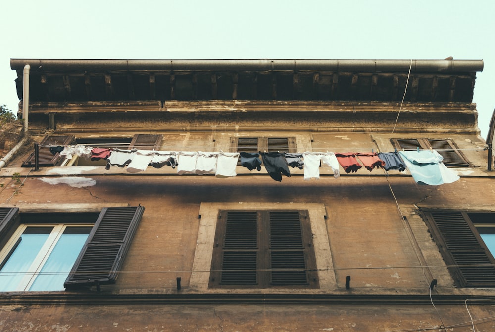 clothes hanging near window on 2nd floor