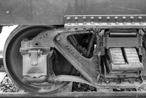 A close-up of a railway wheel showcasing its intricate design.