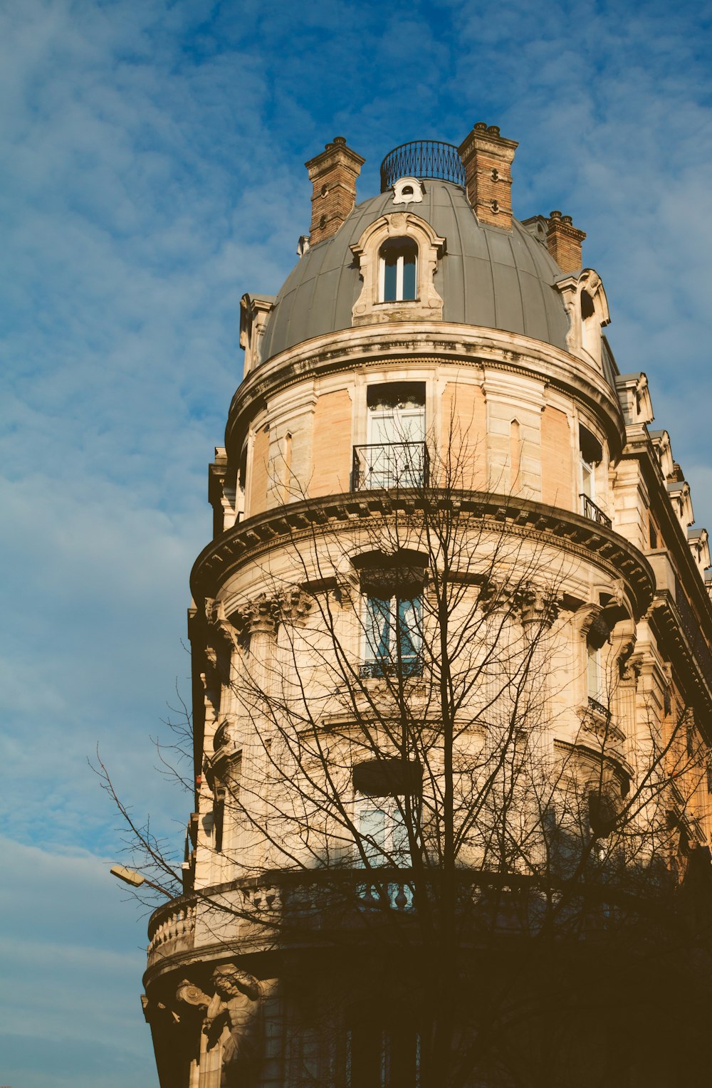 low-angle photography of brown high-rise building