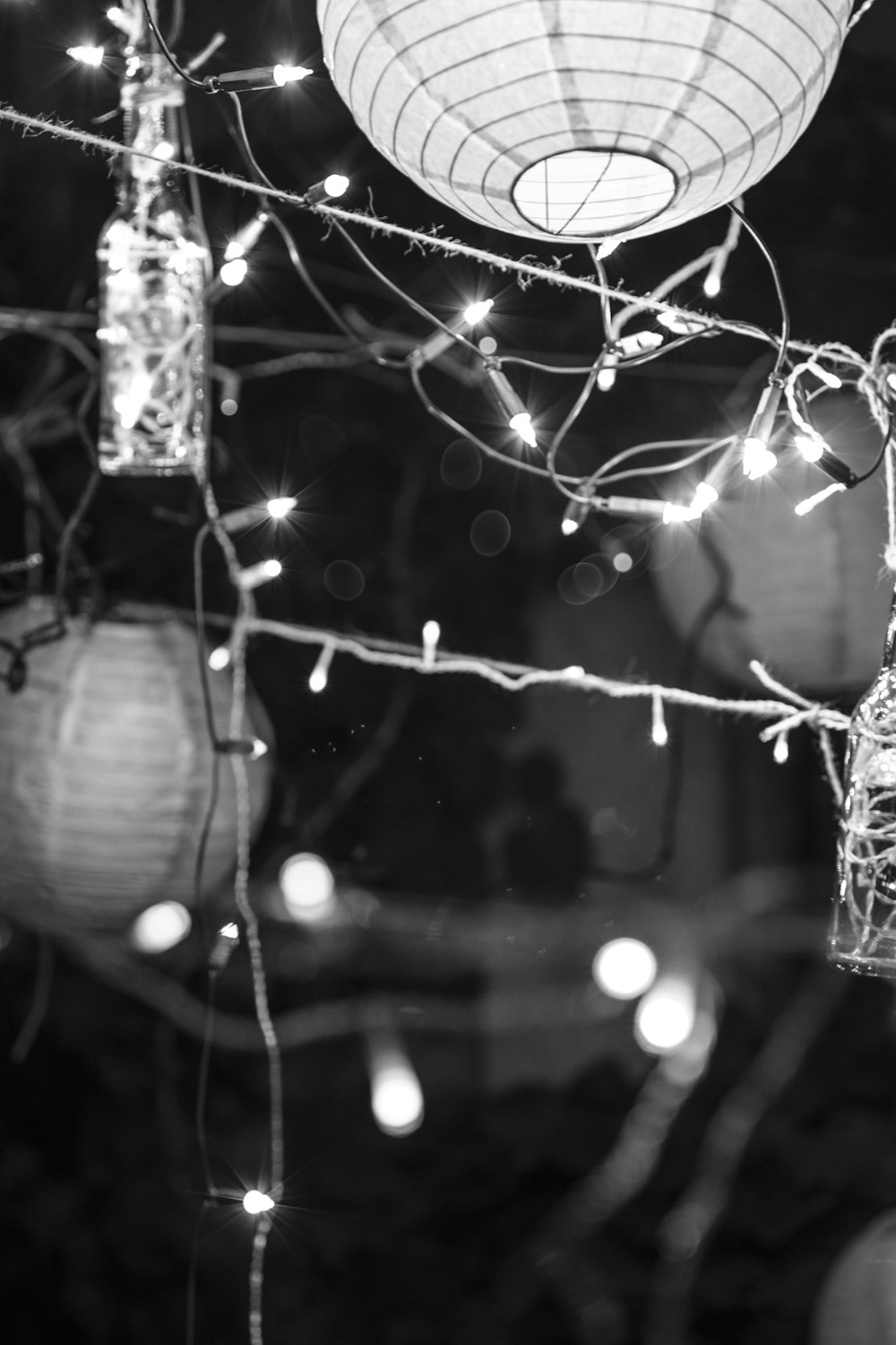 grayscale photo of string lights