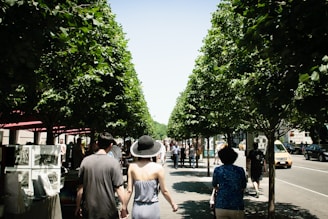 A bustling New York street filled with people enjoying an outdoor art festival.