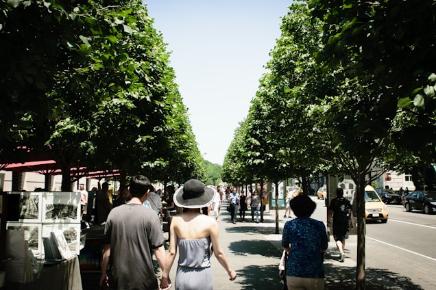 A bustling New York street filled with people enjoying an outdoor art festival.