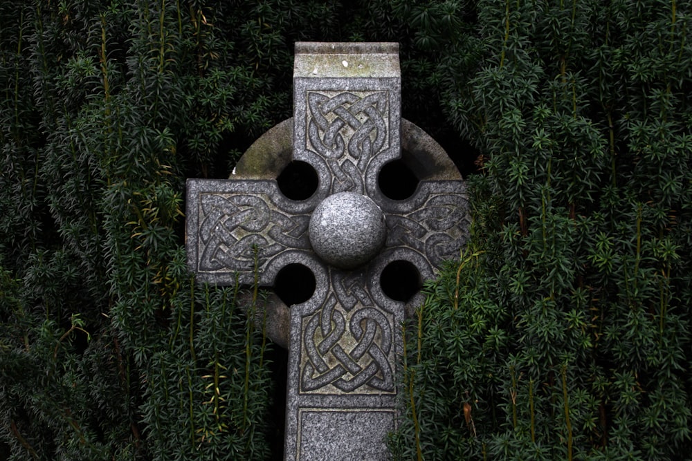 gray concrete cross statue