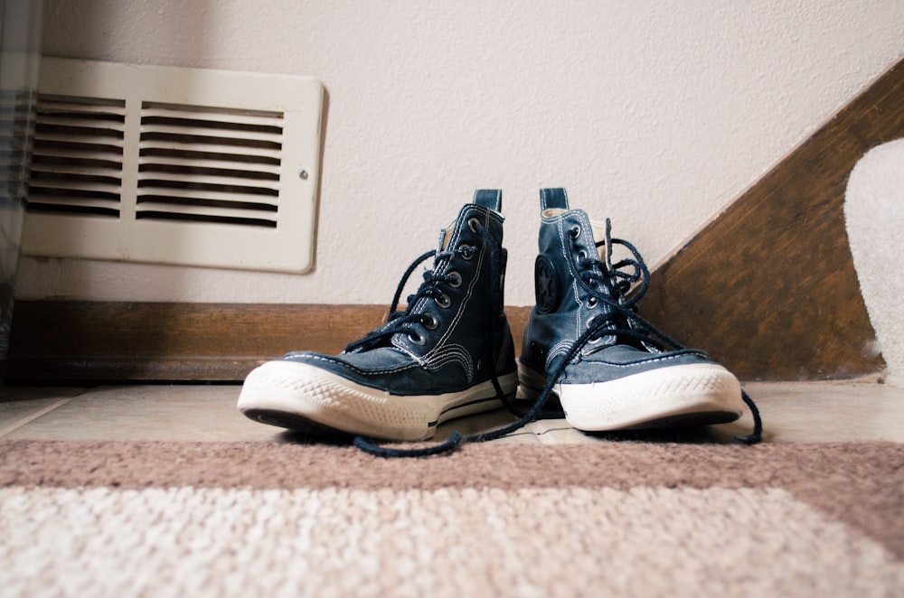 pair of blue high-top sneakers