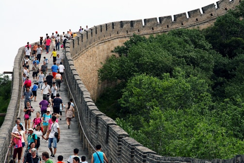 Historic battlefield landscape with visitors walking along a trail.