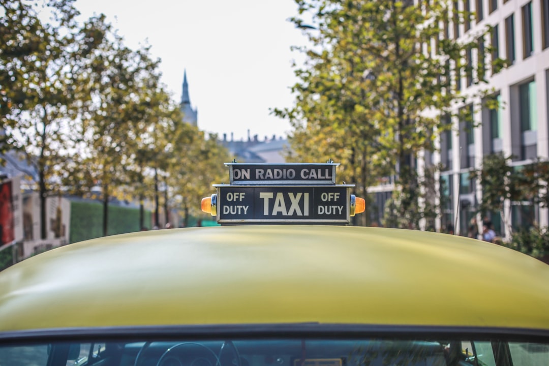 Taxi cab in London leafy street