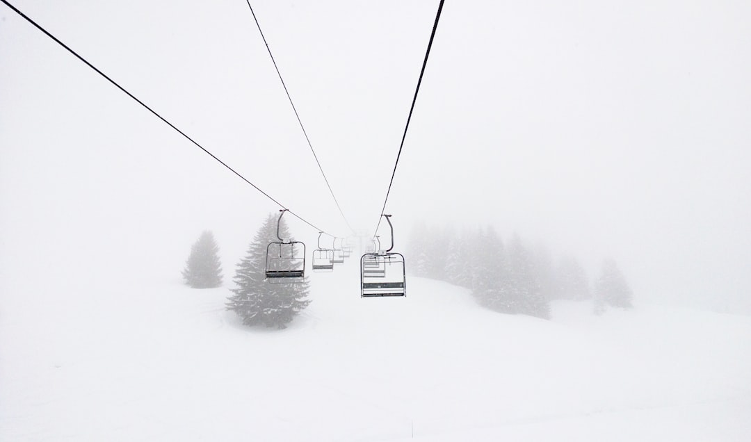 Chairlifts on a snowy ski slope in Morillon