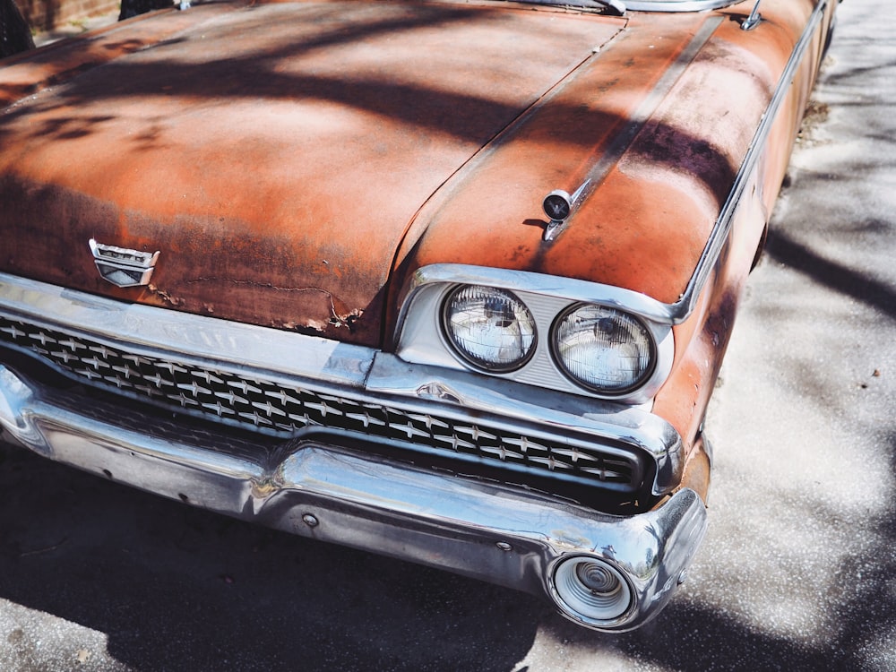 vintage orange car during daytime