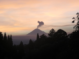 Close-up of volcanic smoke rising from Fuego volcano at dusk