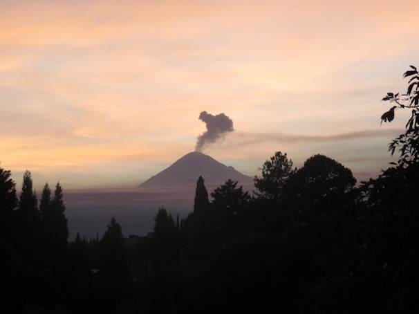 Close-up of volcanic smoke rising from Fuego volcano at dusk