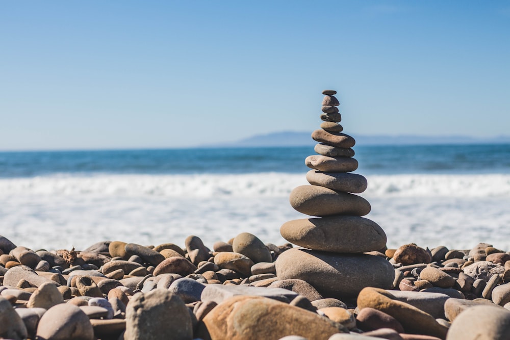 Stone balancing with pebble tower on the Ventura rocky beach