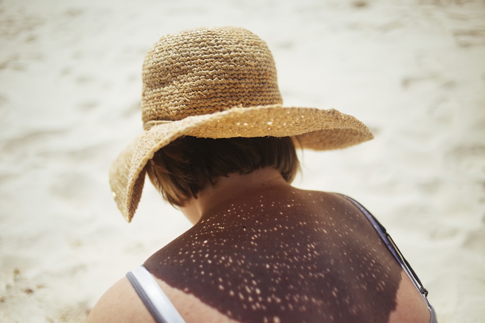 person wearing brown Sunday hat during daytime