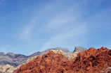 Close-up of a medallion featuring the iconic red rocks of Sedona under a bright blue sky.