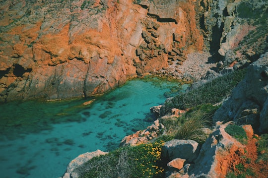 aerial photography of valley with body of water in Arenal d'en Castell Spain