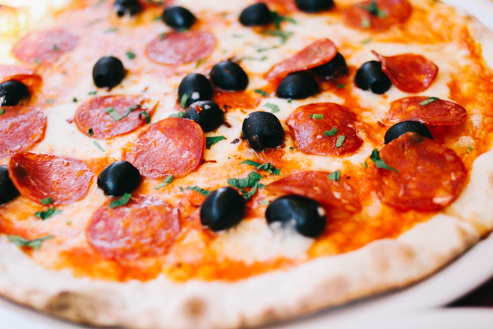 Photo Via: https://unsplash.com/photos/_0JpjeqtSyg, Fresh Italian pizza with cheese, olives, and pepperoni