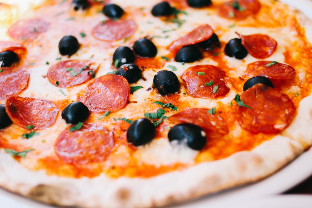 close shot of pizza, Pepperoni and Olive Pizza