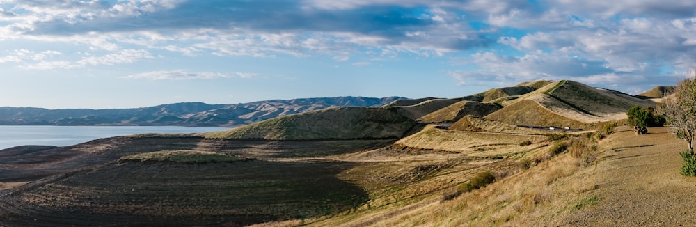 green and brown mountains under blue sky during daytime