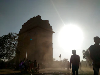 A panoramic view of the monument site at golden hour, with soft light casting long shadows.