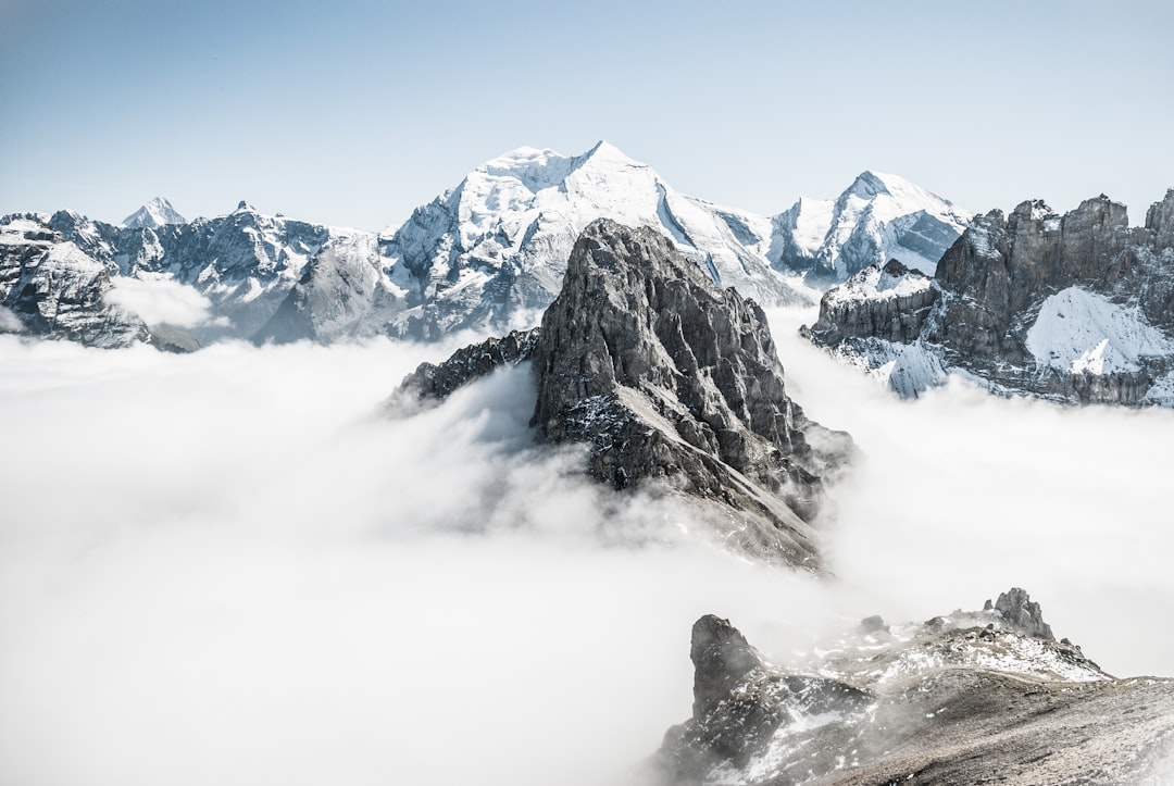 landscape photo of mountain alps, Mountain tops above clouds