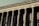 A grand neoclassical building with large stone columns supports a façade inscribed with the words 'FACULTAD DE DERECHO Y CIENCIAS.' The architectural style reflects an imposing and formal design, characteristic of institutional or governmental structures.
