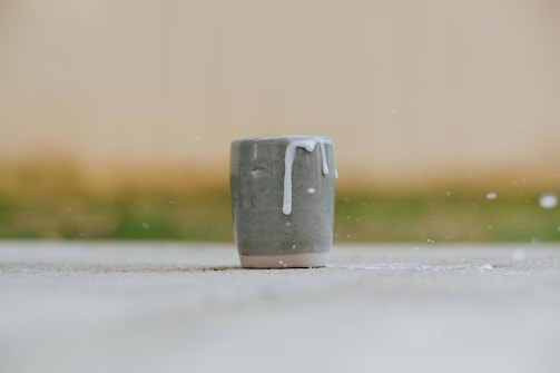 A playful illustration blending a full cup and an empty bowl.