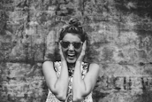 Lifestyle image of a joyful woman enjoying her day, radiating confidence and well-being.