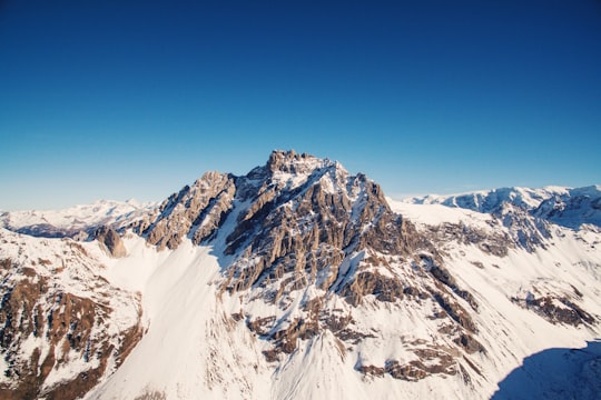 brown mountain covered with snow at daytime in Les Menuires France