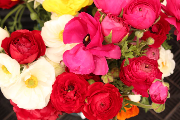 A vibrant bouquet of flowers arranged for a festive event setting.