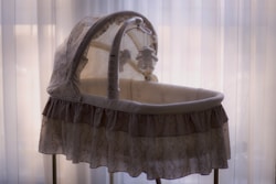 baby's white and black bassinet